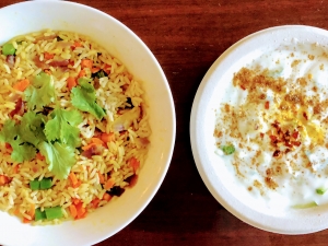 Pictures of Indian dishes Vegetable Pulav and Raita.