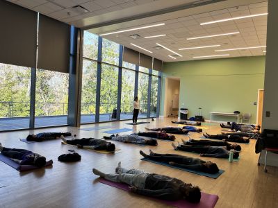 Hindu Chaplain Priya Amaresh leading a yoga class with Duke Hindi students
